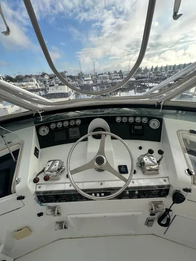  Yacht Photos Pics Cockpit view of 1994 Hatteras 48 Cockpit MY yacht with steering wheel and controls.