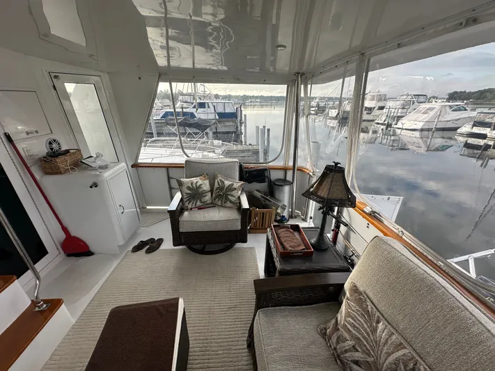 Yacht Photos Pics Interior of 1994 Hatteras 48 Cockpit MY yacht with cozy seating and marina view.