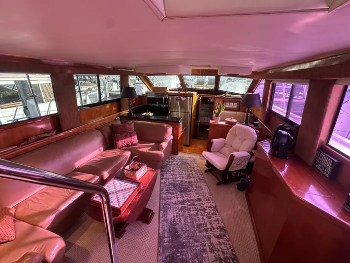  Yacht Photos Pics Luxurious interior of 1994 Hatteras 48 Cockpit MY yacht with plush seating and elegant decor.