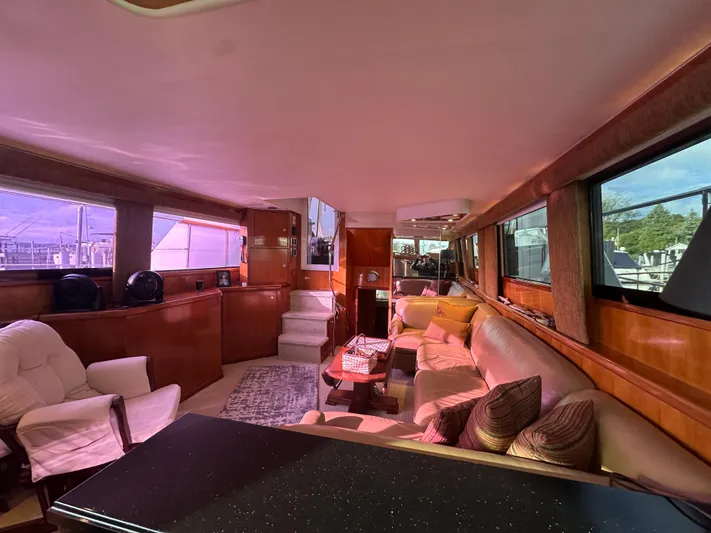  Yacht Photos Pics Luxurious interior of 1994 Hatteras 48 Cockpit MY yacht with plush seating and wood finishes.