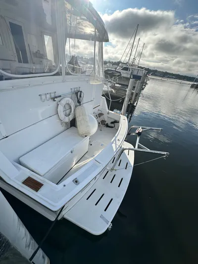  Yacht Photos Pics 1994 Hatteras 48 Cockpit MY yacht docked at marina, rear view.