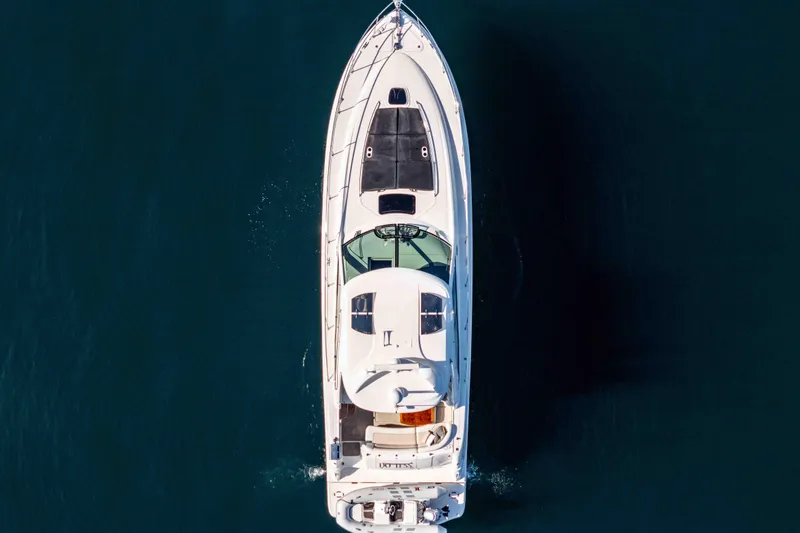 Do Less Yacht Photos Pics Top view of 2007 Sea Ray 48 Sundancer yacht cruising on open water.