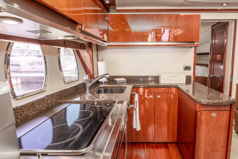 Do Less Yacht Photos Pics Luxurious kitchen interior of 2007 Sea Ray 48 Sundancer yacht with modern amenities.