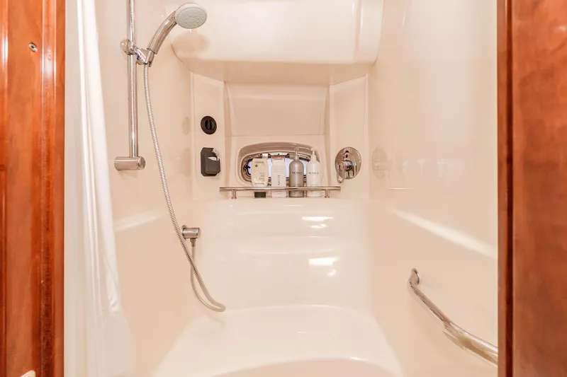 Do Less Yacht Photos Pics Luxurious shower in 2007 Sea Ray 48 Sundancer yacht with modern fixtures.