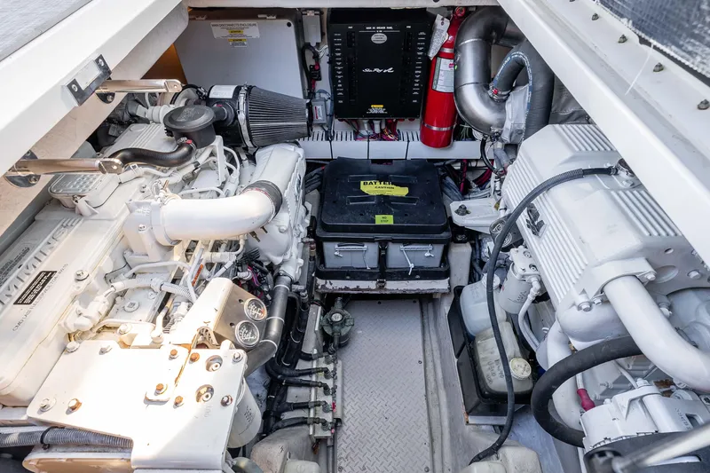 Do Less Yacht Photos Pics Engine room of a 2007 Sea Ray 48 Sundancer yacht, showcasing mechanical components.