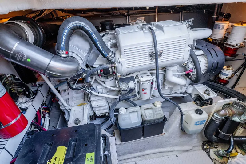 Do Less Yacht Photos Pics Engine room of a 2007 Sea Ray 48 Sundancer, showcasing detailed mechanical components.