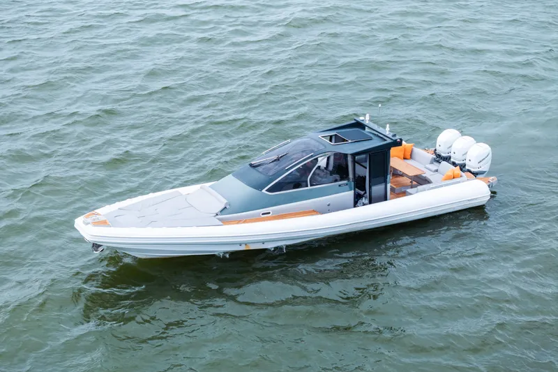  Yacht Photos Pics 2021 Magazzu TARGA 45 boat on water, featuring sleek design and triple outboard engines.