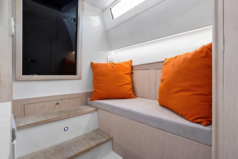  Yacht Photos Pics Interior of 2021 Magazzu TARGA 45 with orange cushions and modern design.