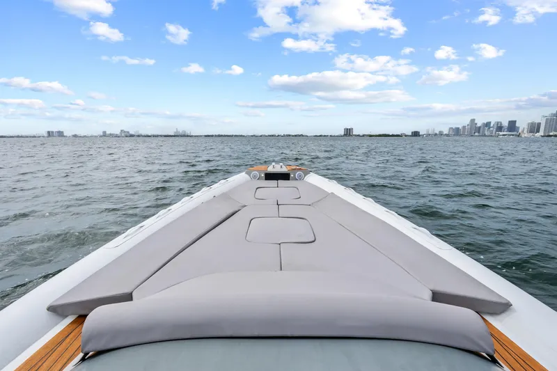  Yacht Photos Pics Magazzu TARGA 45 yacht cruising on open water, city skyline in background, 2021 model.