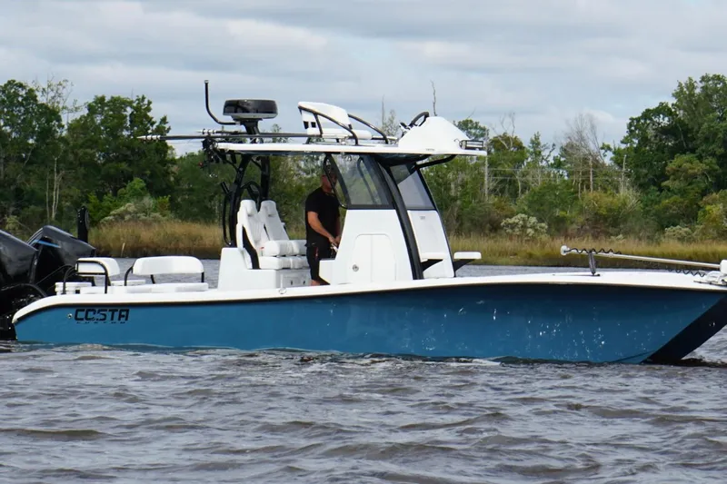  Yacht Photos Pics 2025 Costa Custom Boats 264 HC on water, sleek design, blue hull, modern features.