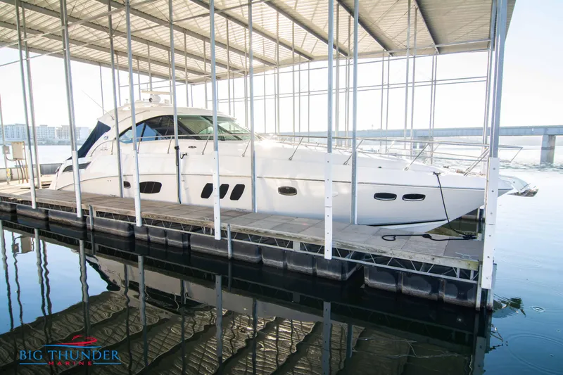 Yacht Photos Pics 2010 Sea Ray 540 Sundancer yacht docked under a covered marina.
