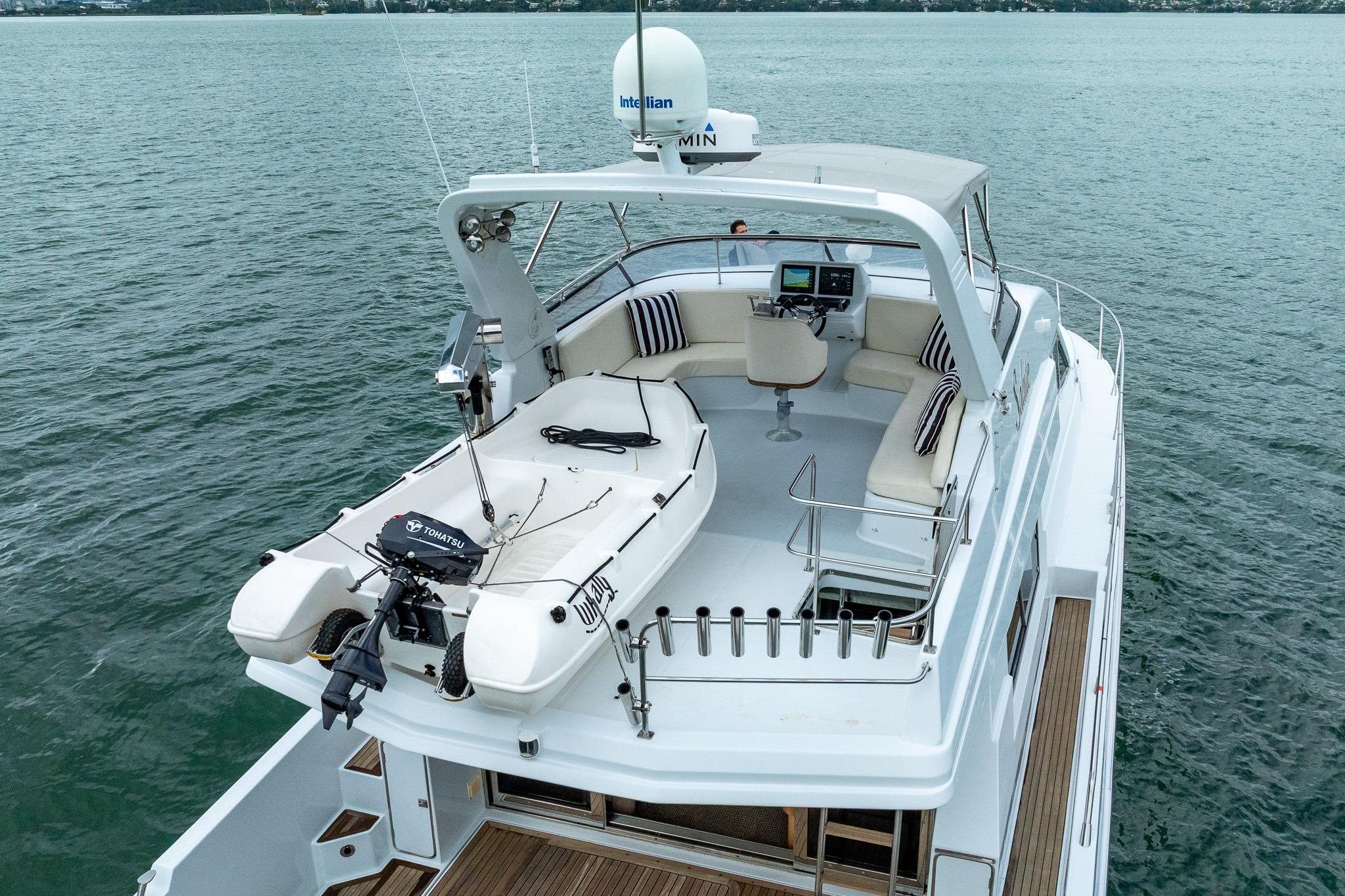 Luxury 1995 Comar Clanship 52 yacht with spacious deck and seating area.