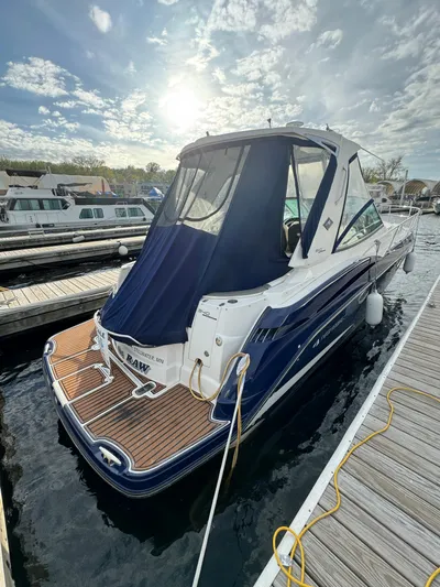 In The Raw Yacht Photos Pics 2013 Monterey 340 SY boat docked at marina under sunny sky.