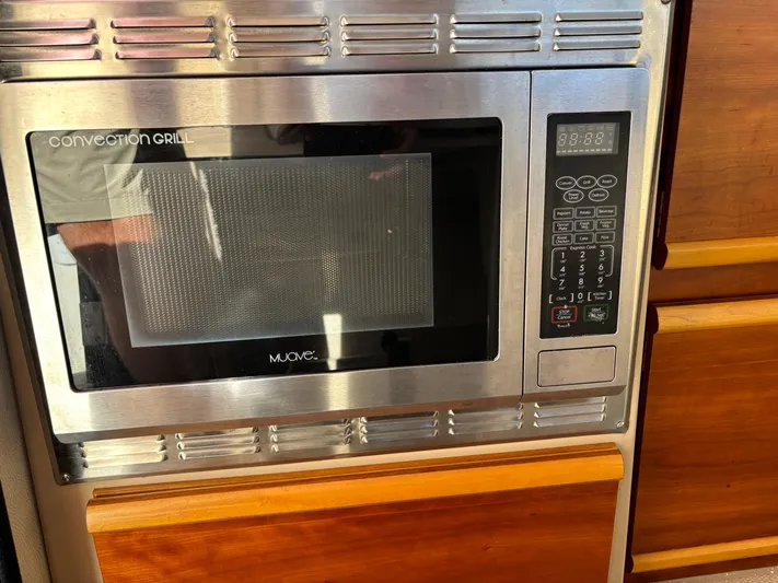 Y Knot Yacht Photos Pics Convection grill microwave in 2017 Cutwater C-28 Deluxe boat kitchen.