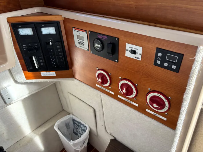 Y Knot Yacht Photos Pics Control panel of a 2017 Cutwater C-28 Deluxe boat with switches and gauges.