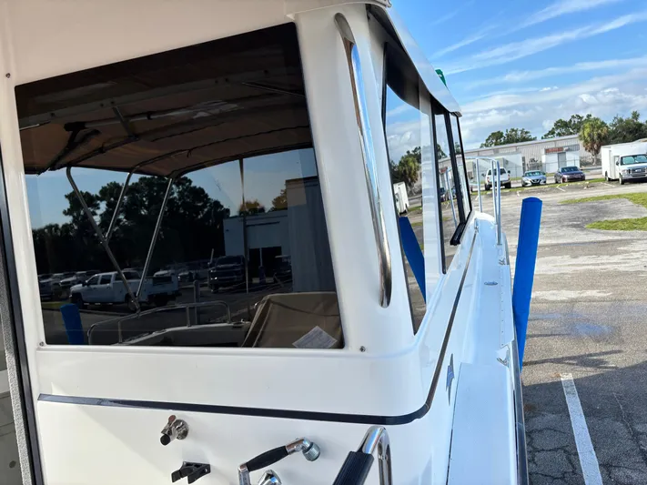 Y Knot Yacht Photos Pics 2017 Cutwater C-28 Deluxe boat side view in a parking lot.