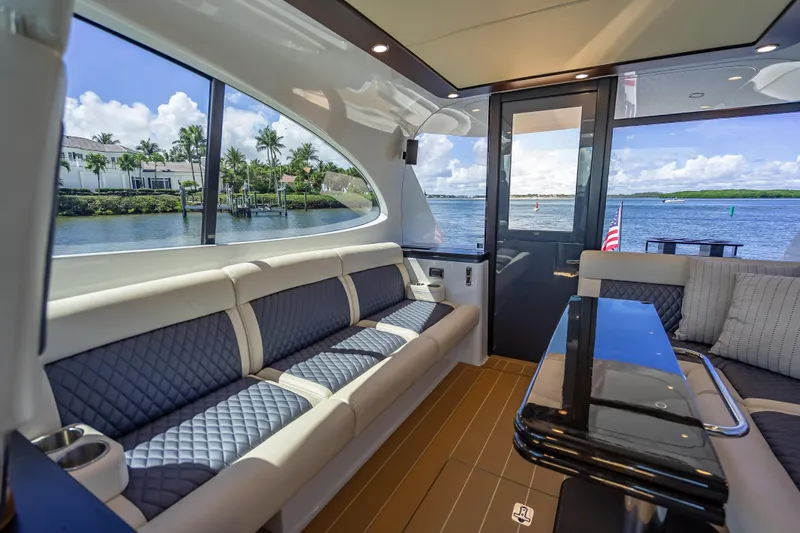 Priceless Yacht Photos Pics Luxurious interior of 2019 Palm Beach Motor Yachts GT50 with waterfront view.