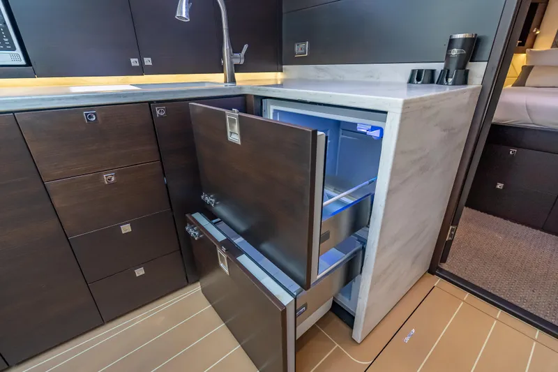 Priceless Yacht Photos Pics Modern kitchen area in 2019 Palm Beach Motor Yachts GT50 with open fridge drawers.