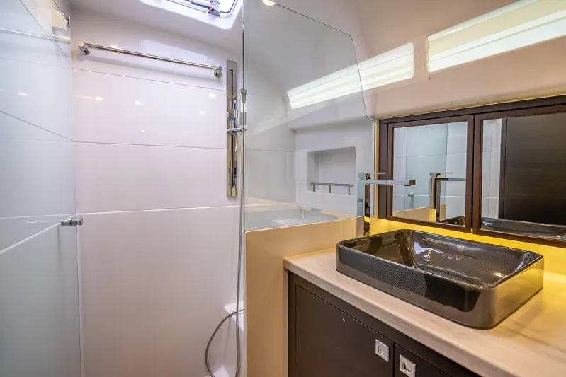 Priceless Yacht Photos Pics Luxurious bathroom in 2019 Palm Beach Motor Yachts GT50, featuring modern sink and shower.