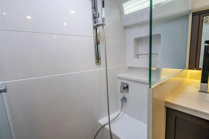 Priceless Yacht Photos Pics Luxurious bathroom in 2019 Palm Beach Motor Yachts GT50, featuring modern shower design.