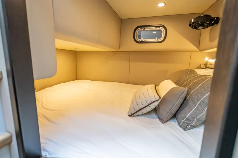 Priceless Yacht Photos Pics Luxurious cabin interior of 2019 Palm Beach Motor Yachts GT50 with cozy bedding.
