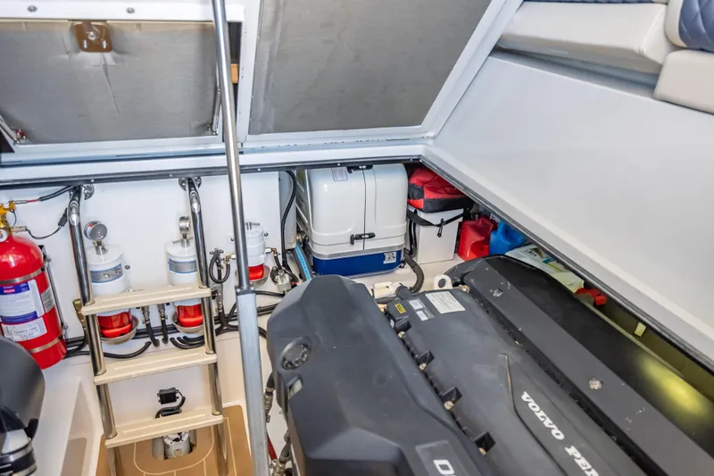 Priceless Yacht Photos Pics Engine room of 2019 Palm Beach Motor Yachts GT50, featuring Volvo Penta engine and safety equipment.