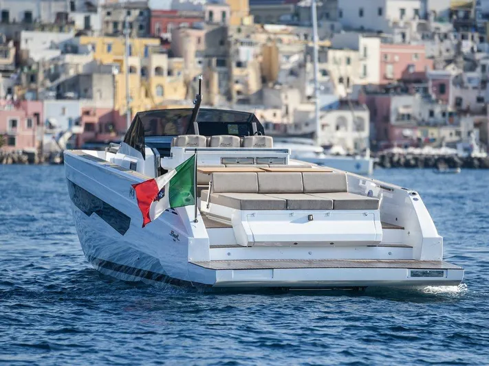 Fiart 43 Yacht Photos Pics 2025 Fiart 43 Seawalker yacht cruising near colorful coastal buildings.