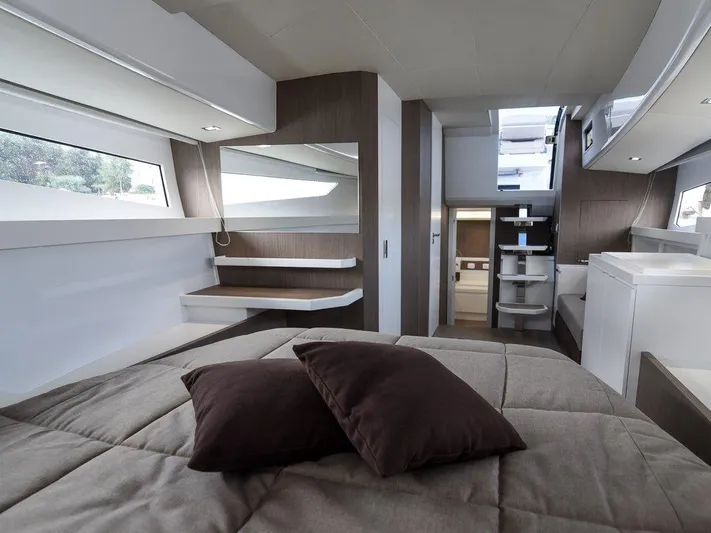 Fiart 43 Yacht Photos Pics Luxurious interior of 2025 Fiart 43 Seawalker yacht with modern design and cozy bedding.