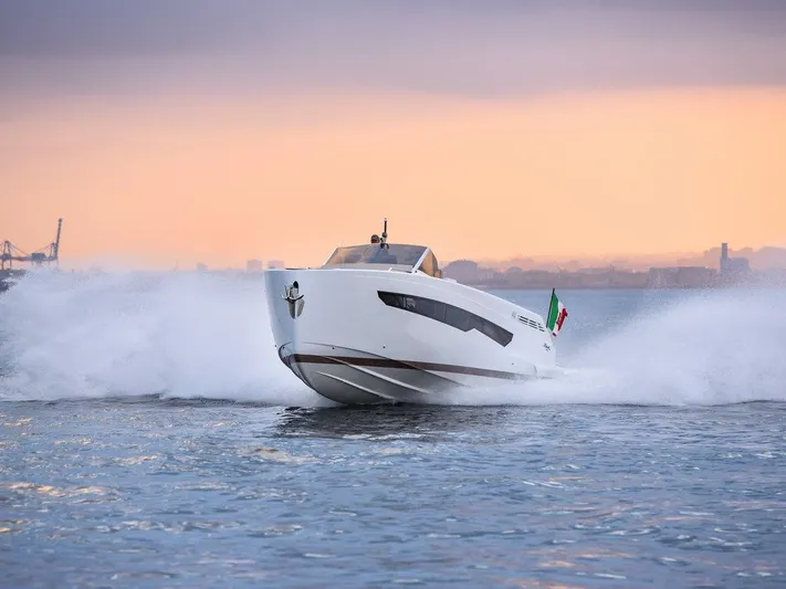 Fiart 43 Yacht Photos Pics 2025 Fiart 43 Seawalker yacht cruising at sunset, creating a dynamic water spray.