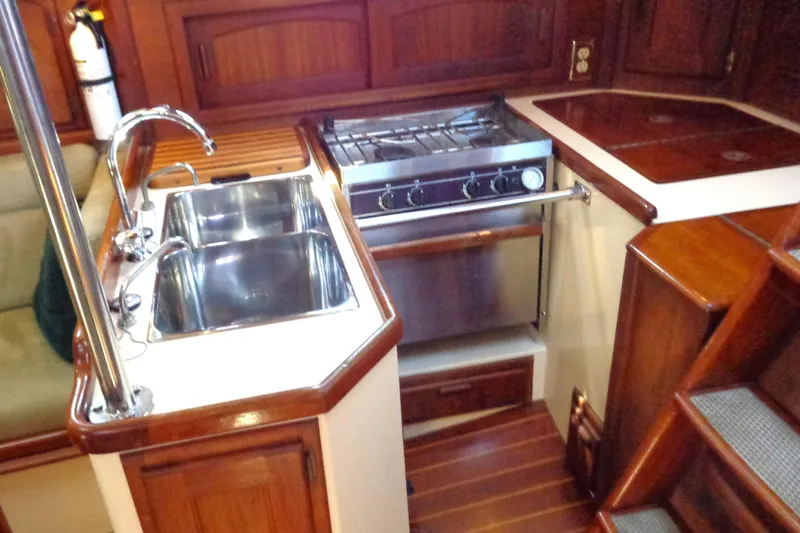 Adventure Yacht Photos Pics Galley kitchen in 1995 Pacific Seacraft 37 sailboat with dual sinks and stove.