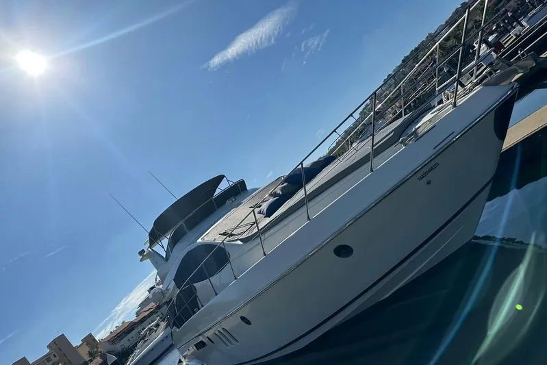 Chica Loca Yacht Photos Pics 2003 Azimut 55E yacht docked under a bright sunlit sky.