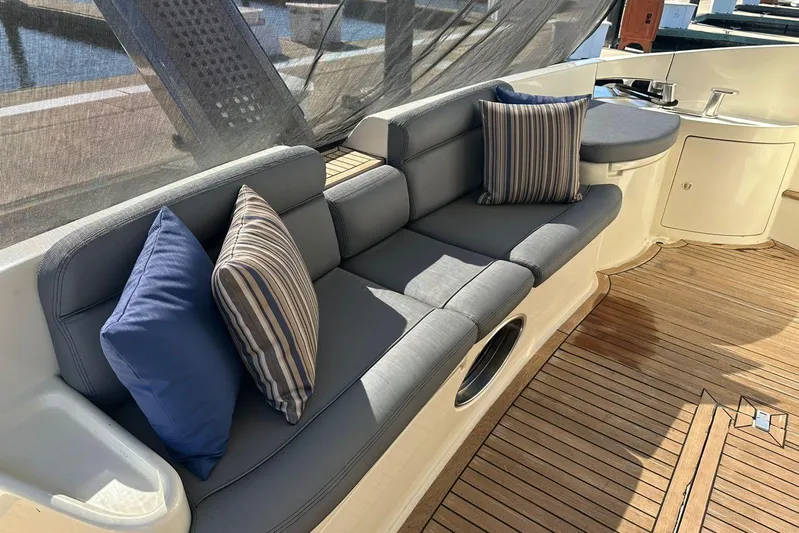 Chica Loca Yacht Photos Pics Luxurious seating area on 2003 Azimut 55E yacht with striped cushions.