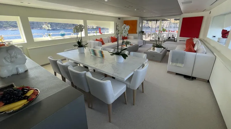 D'one Yacht Photos Pics Luxurious Leopard Yachts 2009 interior with elegant dining area, modern decor, and scenic ocean views.
