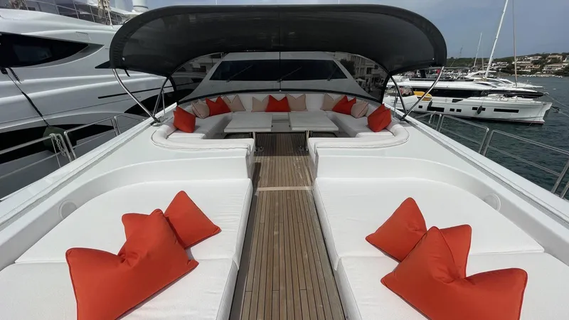 D'one Yacht Photos Pics Luxurious 2009 Leopard Yachts deck with white seating and vibrant orange cushions.