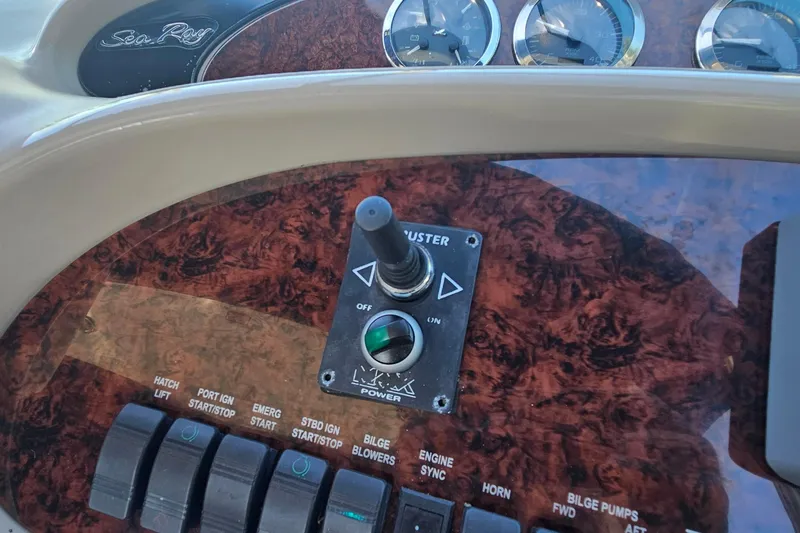 N/a Yacht Photos Pics Control panel of a 2004 Sea Ray 380 Sundancer boat with switches and gauges.