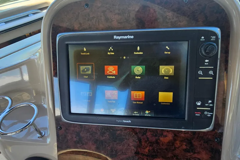 N/a Yacht Photos Pics Raymarine display on 2004 Sea Ray 380 Sundancer boat dashboard, showing navigation options.