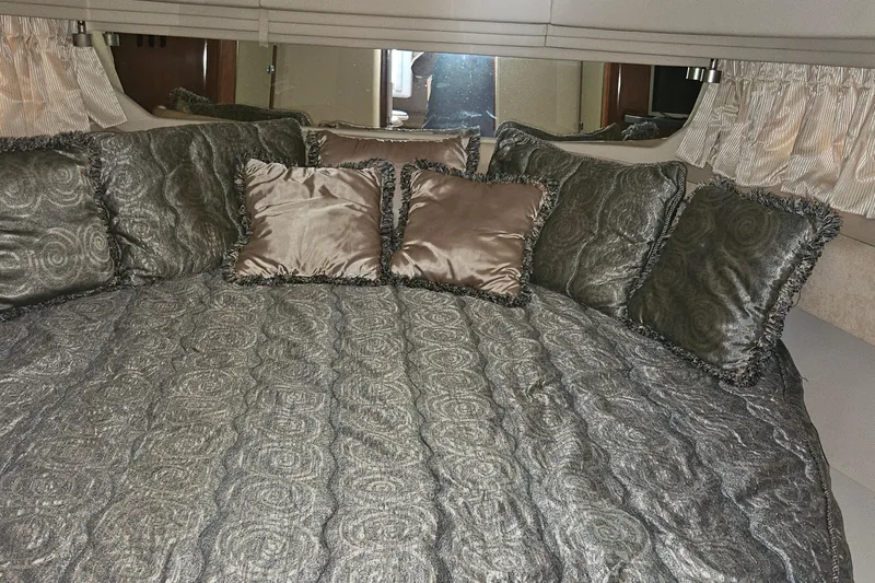 N/a Yacht Photos Pics Luxurious cabin interior of 2004 Sea Ray 380 Sundancer with elegant bedding and pillows.