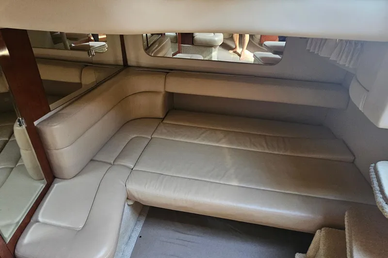 N/a Yacht Photos Pics Interior of 2004 Sea Ray 380 Sundancer with beige leather seating and mirrored walls.