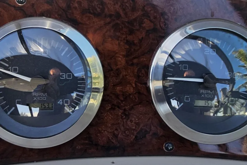N/a Yacht Photos Pics Close-up of 2004 Sea Ray 380 Sundancer RPM gauges on a wooden dashboard.