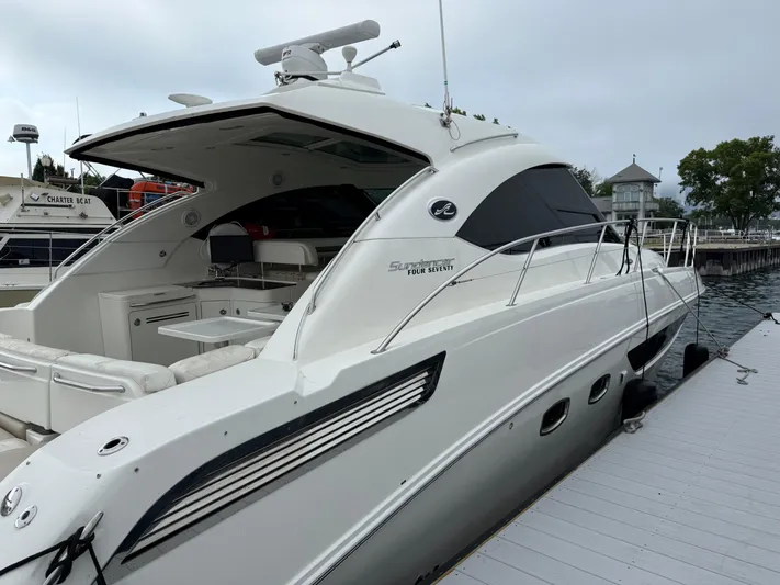 Cabby 13 Yacht Photos Pics 2013 Sea Ray 470 Sundancer yacht docked at marina, showcasing sleek design and luxury features.