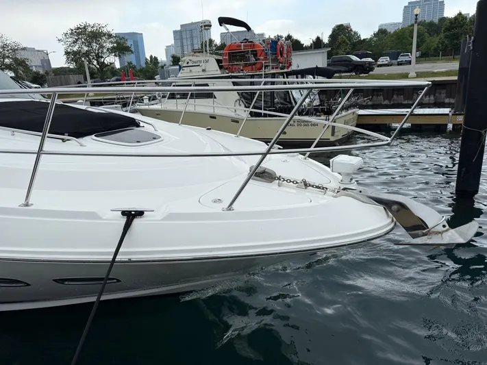 Cabby 13 Yacht Photos Pics 2013 Sea Ray 470 Sundancer yacht docked in marina, with cityscape background.