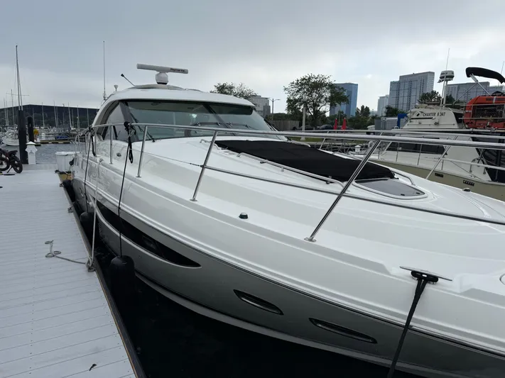 Cabby 13 Yacht Photos Pics 2013 Sea Ray 470 Sundancer yacht docked at marina, sleek design, overcast sky.