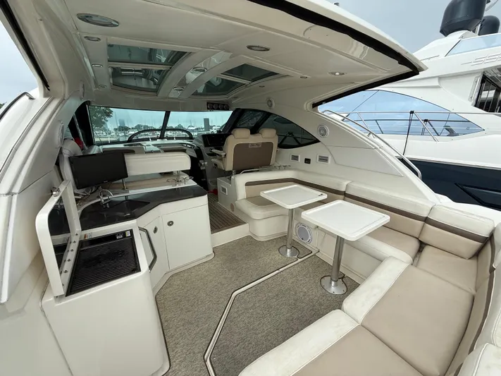 Cabby 13 Yacht Photos Pics Luxurious interior of 2013 Sea Ray 470 Sundancer yacht with seating and dining area.