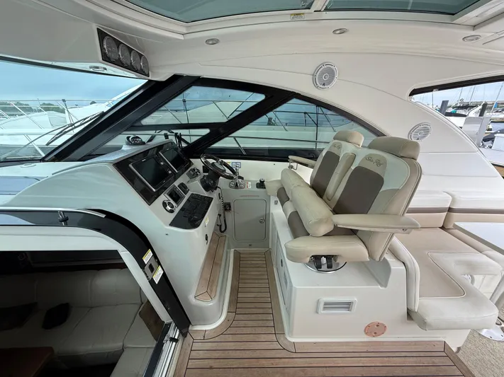 Cabby 13 Yacht Photos Pics 2013 Sea Ray 470 Sundancer helm with dual seats and modern controls.