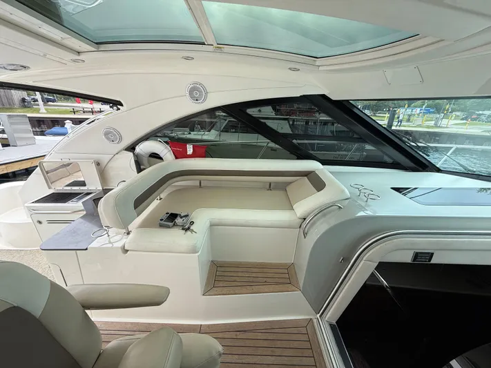 Cabby 13 Yacht Photos Pics Luxurious interior of 2013 Sea Ray 470 Sundancer yacht with seating and modern amenities.