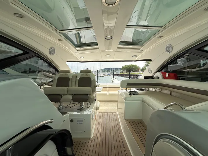 Cabby 13 Yacht Photos Pics Interior of 2013 Sea Ray 470 Sundancer yacht with luxurious seating and panoramic windows.