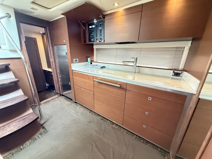 Cabby 13 Yacht Photos Pics Luxurious kitchen interior of 2013 Sea Ray 470 Sundancer yacht with modern wood cabinetry.