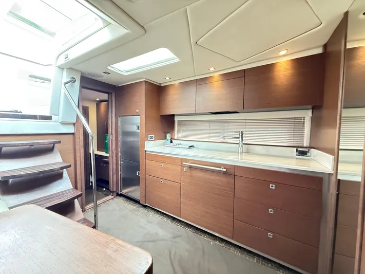 Cabby 13 Yacht Photos Pics Luxurious interior of 2013 Sea Ray 470 Sundancer yacht with modern kitchen design.