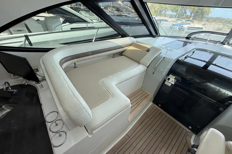 Cabby 13 Yacht Photos Pics Luxurious interior of 2013 Sea Ray 470 Sundancer yacht with plush seating and sleek design.