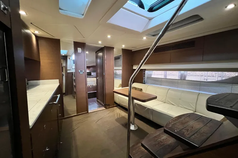 Cabby 13 Yacht Photos Pics Luxurious interior of 2013 Sea Ray 470 Sundancer yacht with modern furnishings.